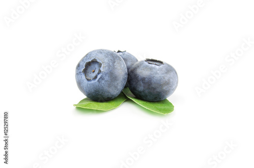 Three ripe blueberries, isolated on white background
