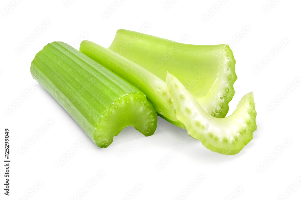 Green fresh celery pieces isolated on white Green fresh celery pieces isolated on white