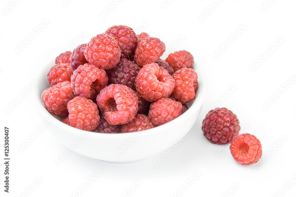Raspberries in a bowl isolated on white background Raspberries in a bowl isolated on white background