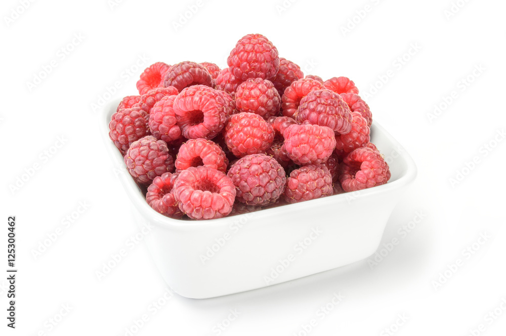 Raspberries on plate over white Raspberries on plate over white