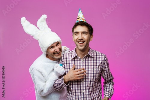Wallpaper Mural Drunk man and rabbit at birthday party over purple background. Torontodigital.ca
