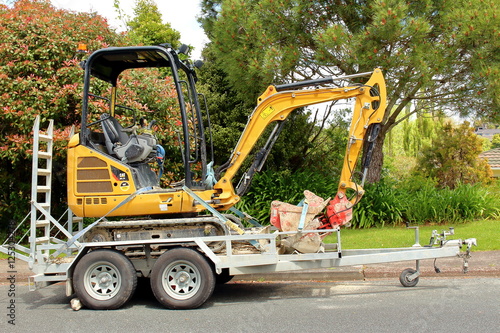 excavator on trailer for transportation