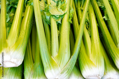 Celery bunches displayed at a farmers market. Close up detail 