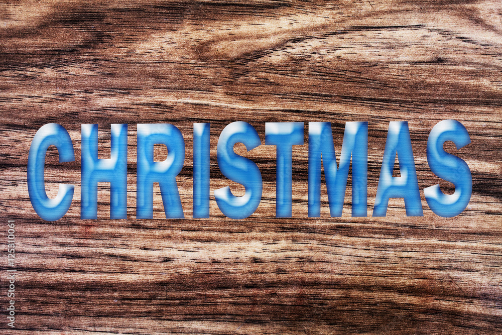 Fototapeta premium word christmas on wooden background