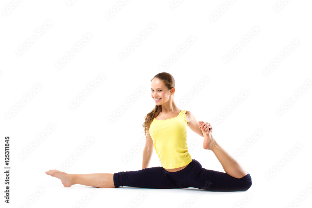 Beautiful fitness woman stretches.