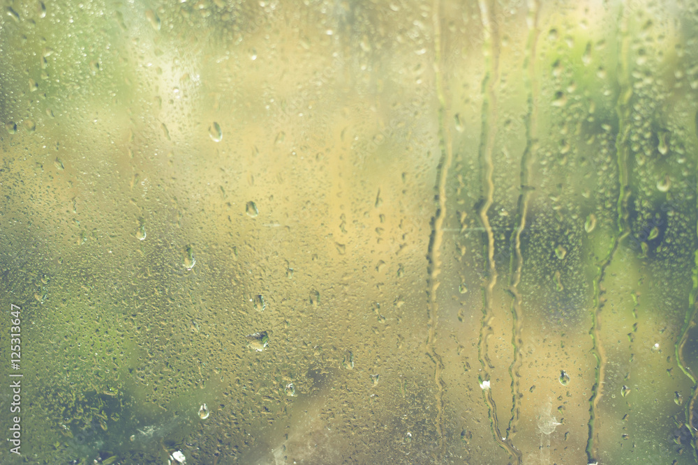 Rainy day. Water drops on window glass.