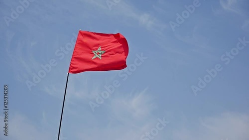 Slow motion footage of the Moroccan flag.