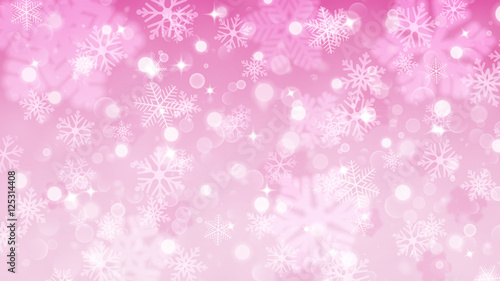 Christmas background of fuzzy and focused snowflakes