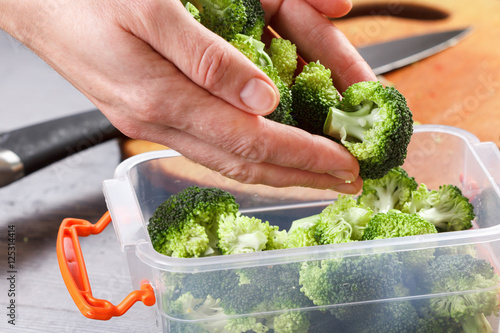 Trays with raw broccoli for freezing.