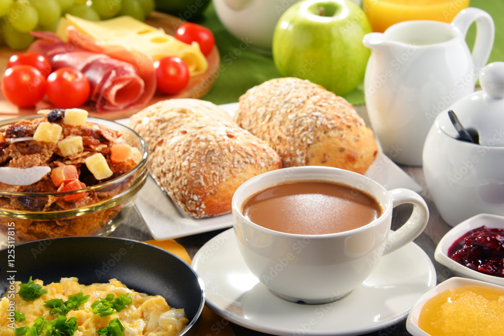 Breakfast served with coffee, juice, egg, and rolls Breakfast served with coffee, juice, egg, and rolls