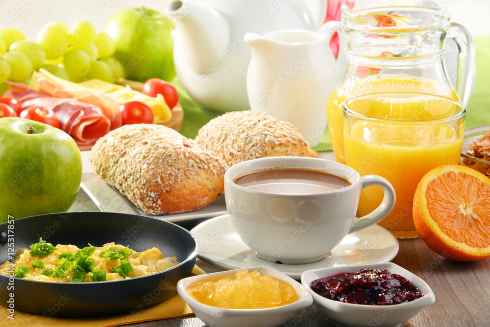 Breakfast served with coffee, juice, egg, and rolls Breakfast served with coffee, juice, egg, and rolls