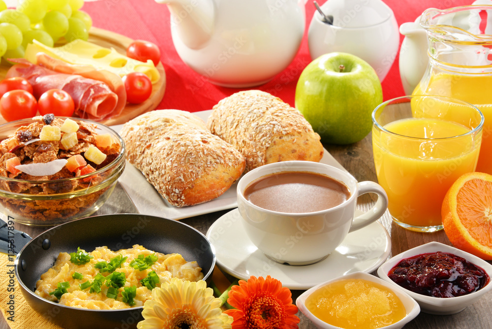 Breakfast served with coffee, juice, egg, and rolls Breakfast served with coffee, juice, egg, and rolls