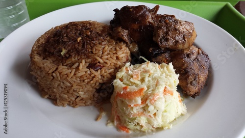 Mouthwatering Spicey Barbecue Jamaican Jerk Chicken and Rice with Beans