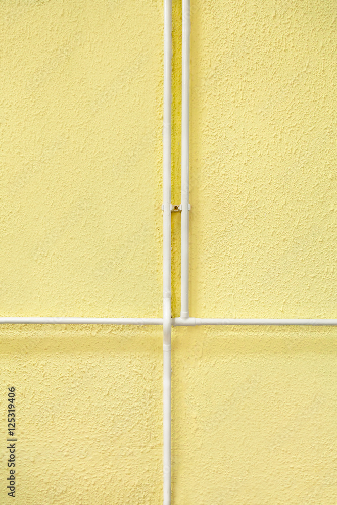 Fototapeta premium intersections of the heat pipe on the yellow wall