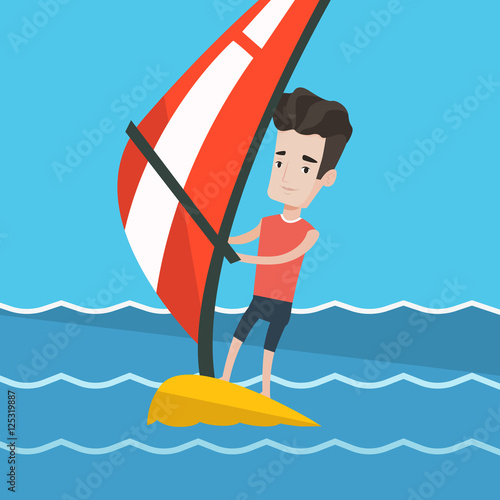 Young man windsurfing in the sea.
