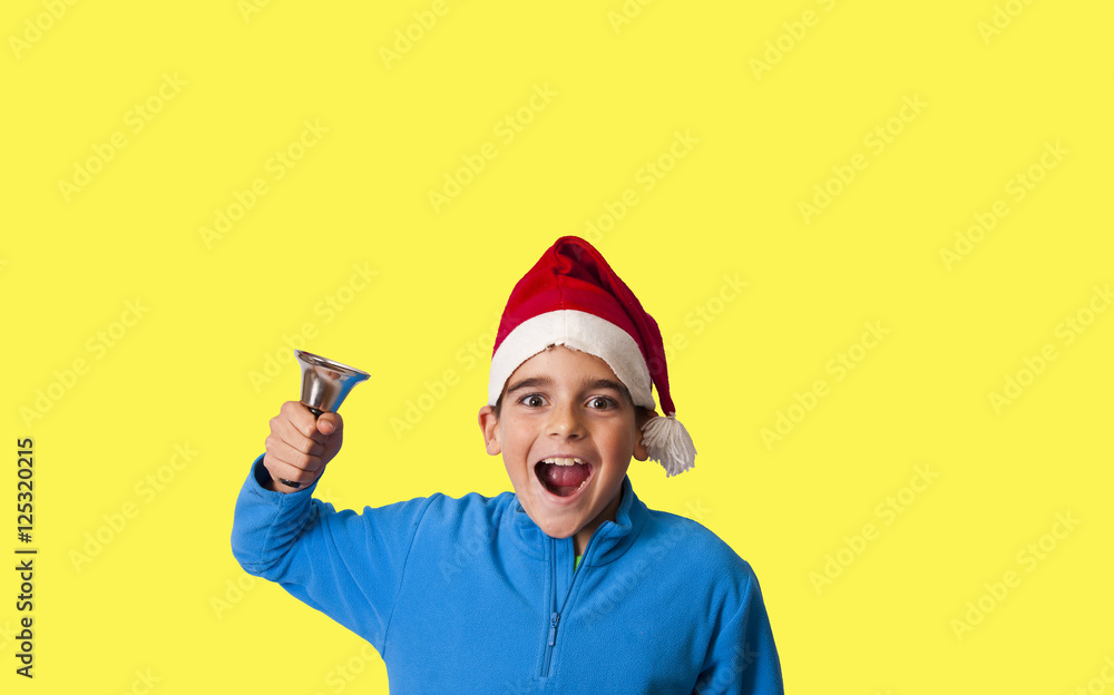 happy child with bell and christmas hat happy child with bell and christmas hat