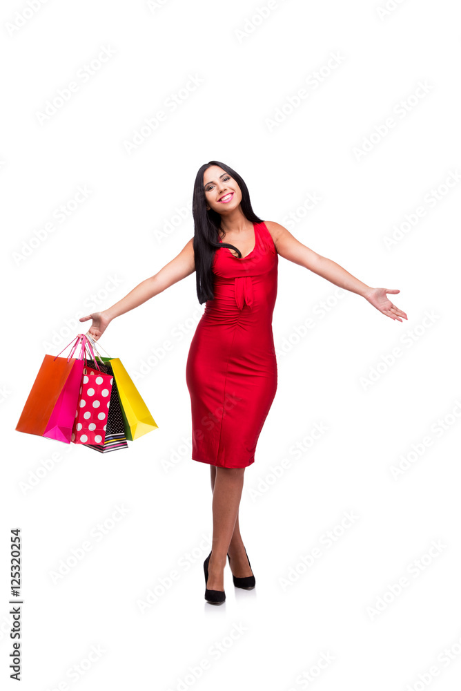 Woman in red dres after shopping isolated on white