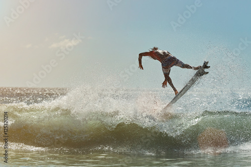 surfer jump on water wave