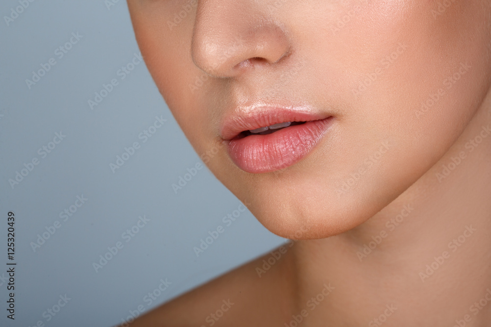 Perfect natural lip makeup. Close up macro photo with beautiful female mouth. Plump full lips. Close-up face detail. Perfect clean skin, light fresh lip make-up. Beautiful spa tender lip Perfect natural lip makeup. Close up macro photo with beautiful female mouth. Plump full lips. Close-up face detail. Perfect clean skin, light fresh lip make-up. Beautiful spa tender lip