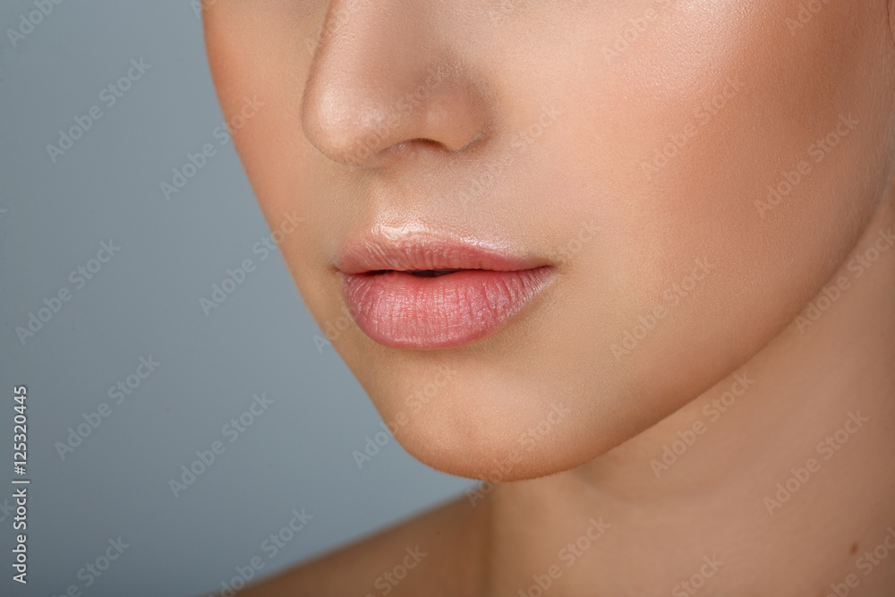 Perfect natural lip makeup. Close up macro photo with beautiful female mouth. Plump full lips. Close-up face detail. Perfect clean skin, light fresh lip make-up. Beautiful spa tender lip Perfect natural lip makeup. Close up macro photo with beautiful female mouth. Plump full lips. Close-up face detail. Perfect clean skin, light fresh lip make-up. Beautiful spa tender lip