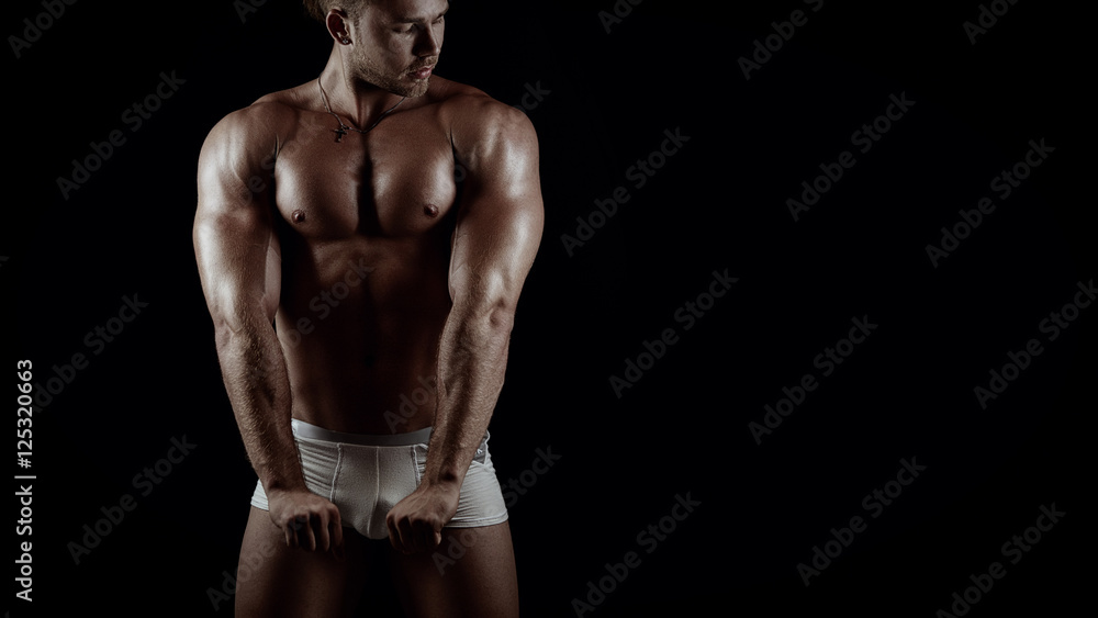 Fototapeta premium Young handsome bodybiulder