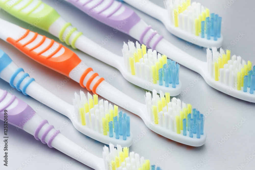 Colorful toothbrushes on the table Colorful toothbrushes on the table