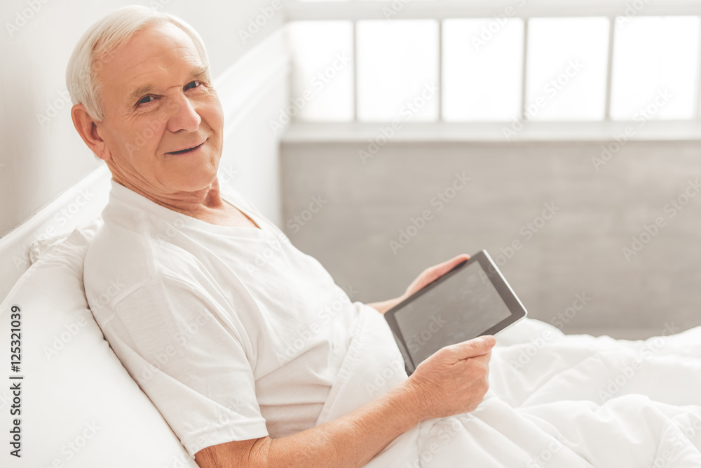 Old man with gadget Old man with gadget