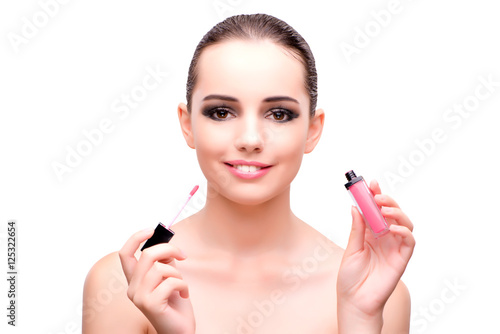 Woman with a lipstick isolated on white