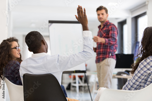 Obraz na plátně Businessman giving a presentation to his colleagues at work