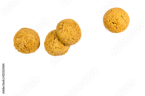 Four scattered ginger nuts in a row