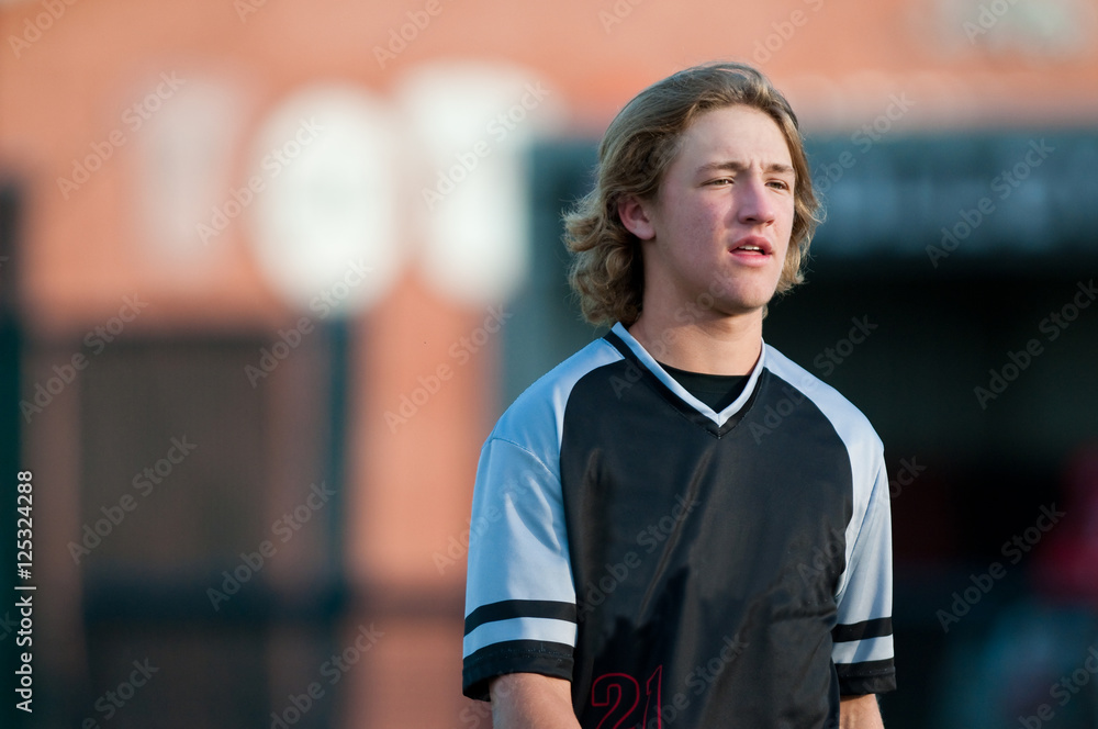 Fototapeta premium High school baseball player with long hair