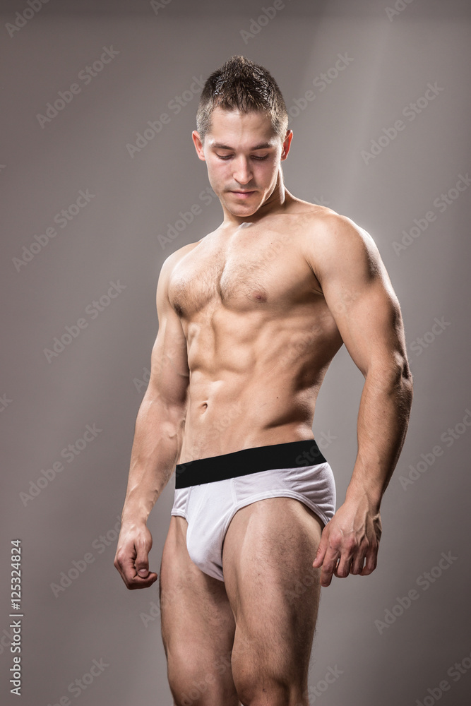 young bodybuilder posing underwear, muscle.