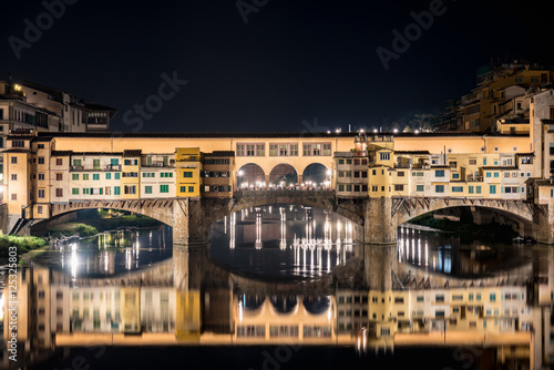 Night view of the historic bridge of Ponte Vecchio in Florence