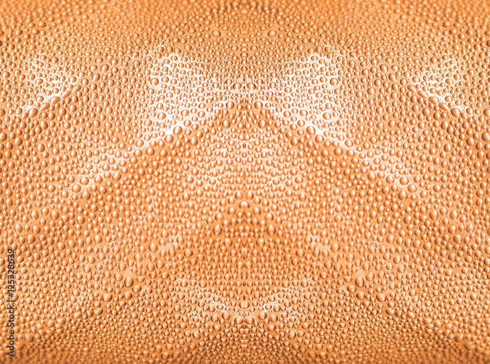 Obraz premium Water drop on bottle with orange color