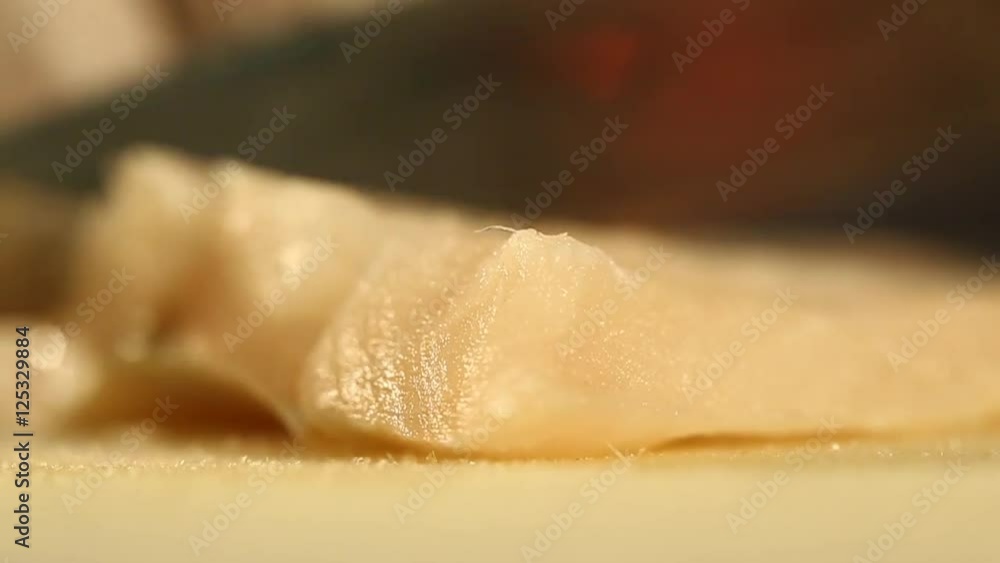 Slicing a Fish Fillet on a Cutting Board Close Up Slicing a Fish Fillet on a Cutting Board Close Up
