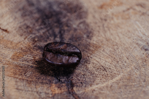 Coffee Bean on wood background with filter effect retro vintage