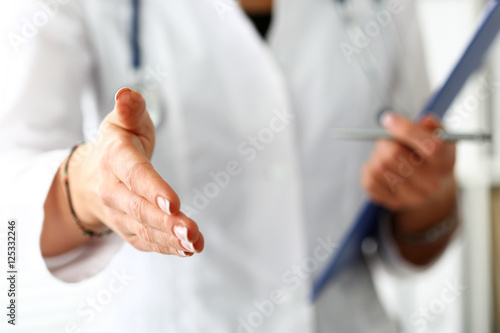 Female medicine doctor offering hand to shake