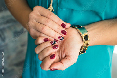 Beautiful woman's nails with beautiful red manicure