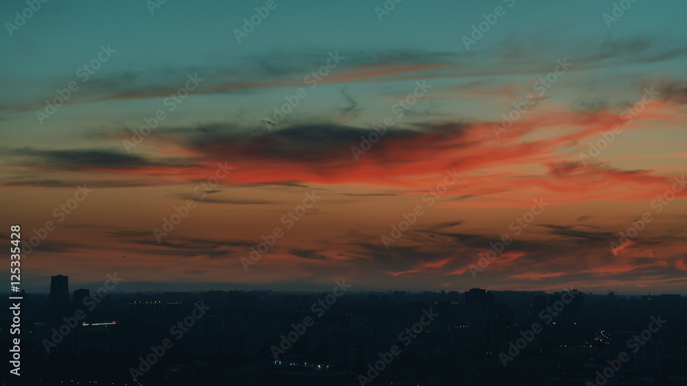 Dramatic red scenery of the city silhouette at sunset
