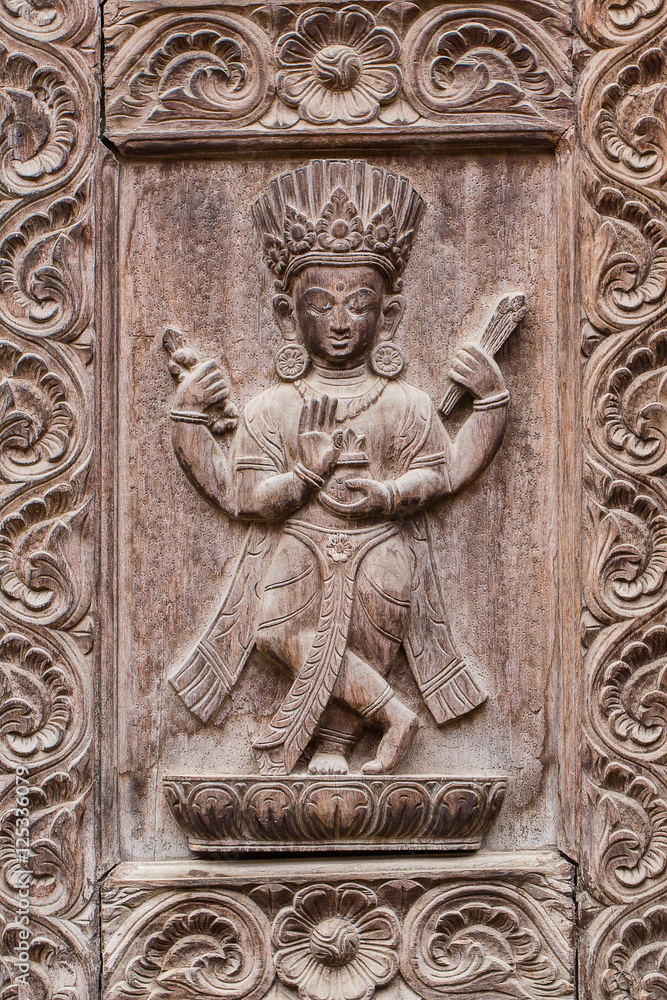 Detail wooden carved door in hindu temple, Kathmandu, Nepal background. Close up