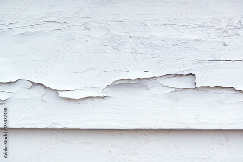 Cracked white paint on plank surface