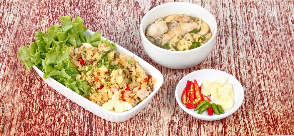 Home made,Fried garlic jasmine rice with minced pork served with side dish as Macaroni chicken soup and spicy filling Home made,Fried garlic jasmine rice with minced pork served with side dish as Macaroni chicken soup and spicy filling