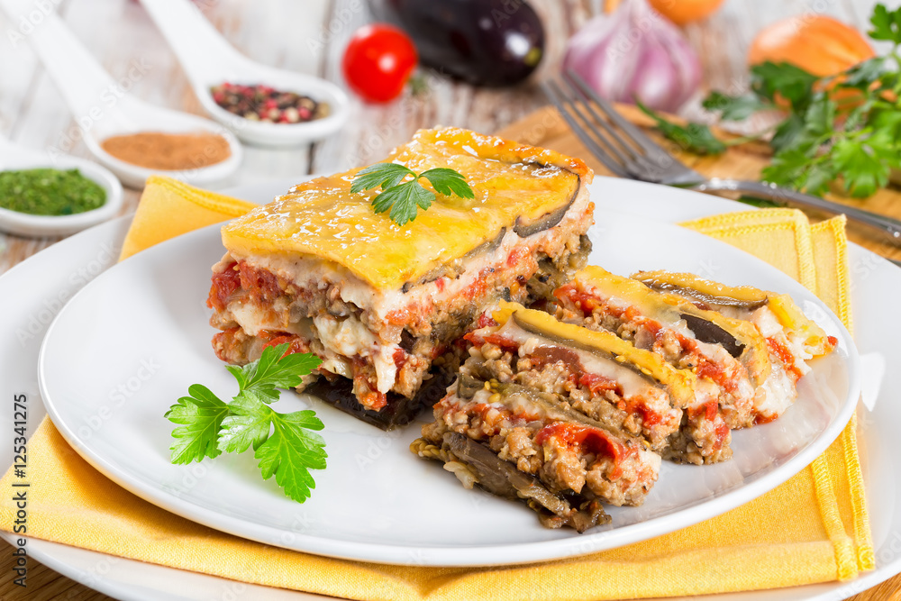portion of delicious layered moussaka cut into slices portion of delicious layered moussaka cut into slices