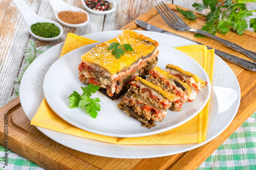 portion of delicious moussaka decorated with parsley