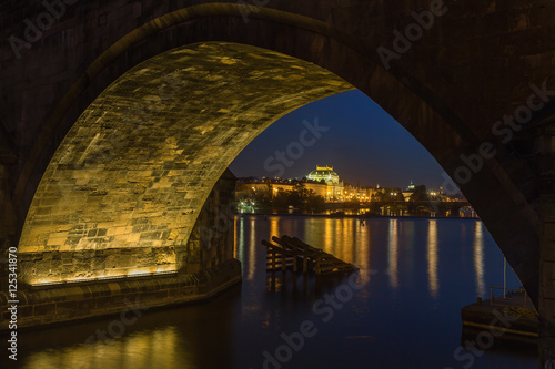 National theatre at night in Prague on the Vltava river, view under Charles bridge, Czech Republic