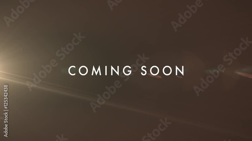 COMING SOON subtle yellow flare reveal