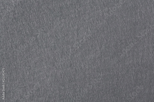 Texture of dark gray felt for backgrounds.