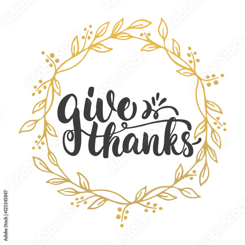 Give thanks - lettering calligraphy phrase with leaves on the background with golden wreath. Autumn Thanksgiving Day greeting card.