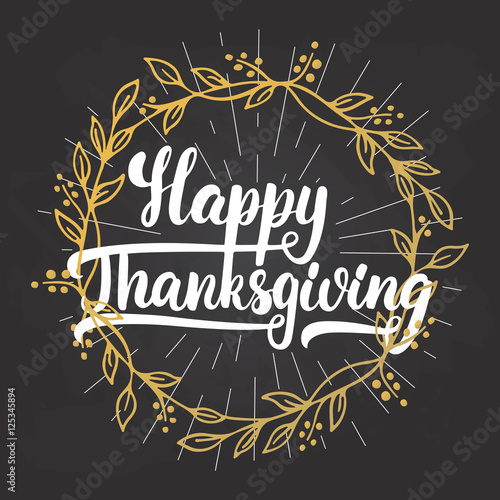 Happy Thanksgiving - lettering calligraphy phrase with light rays and golden wreath. Autumn greeting card isolated on the black chalkboard background.