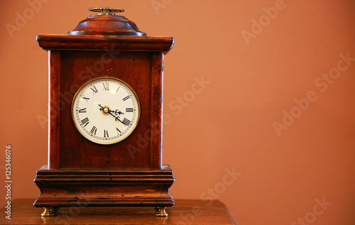 Table clock of the old wooden frame